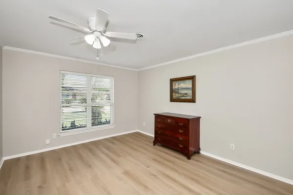 a room with a bed and a window