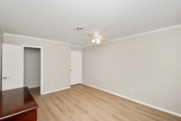 a view of a room with wooden floor