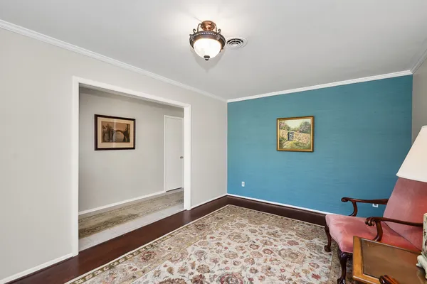 a bedroom with a bed and a lamp