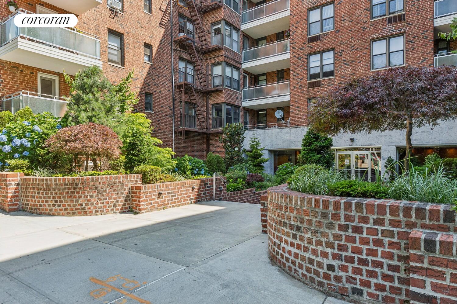 9511 Shore Road, Unit 609 Brooklyn, NY 11209 - Photo 15 of 16 front view of a building with a garden