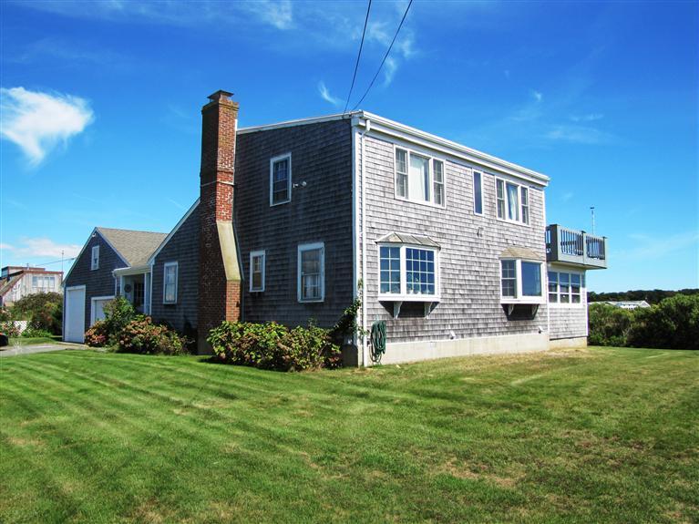 14 Polticki Road West Dennis, MA 02670 - Photo 5 of 24 a brick house with a big yard and potted plants in front of main door