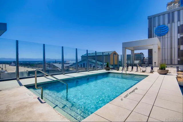 a view of a swimming pool with a lounge chairs