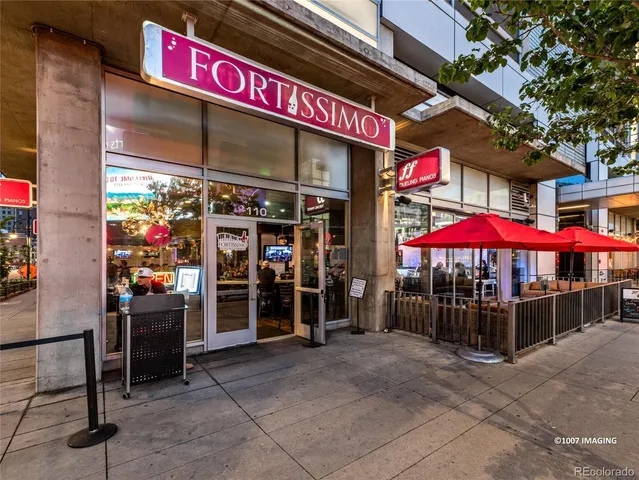 a view of a cafe with sitting area