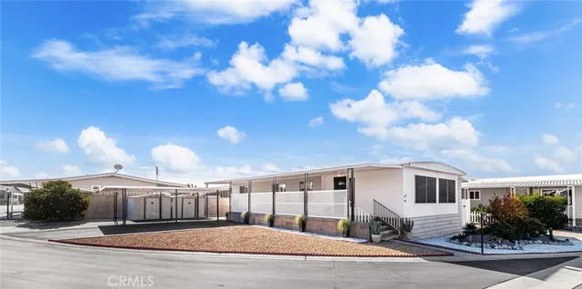 a view of a house with a street view and sitting area