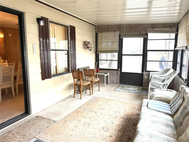 a view of a livingroom with furniture and window