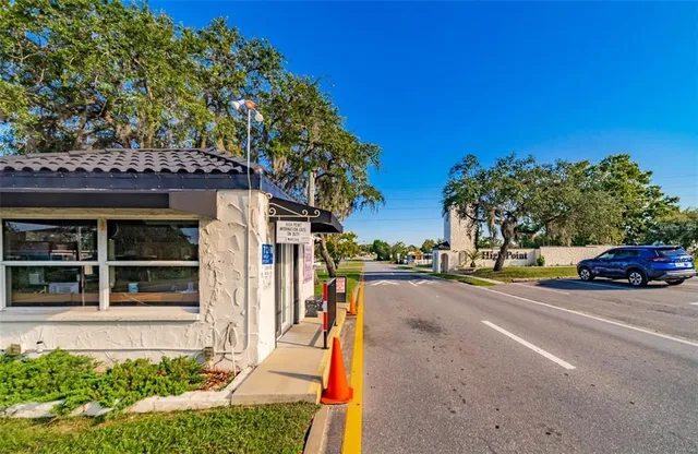 a view of a street with a building in the background