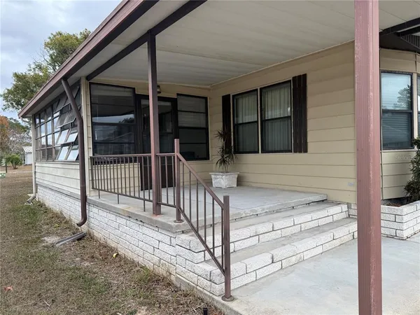 a view of entrance gate of a house