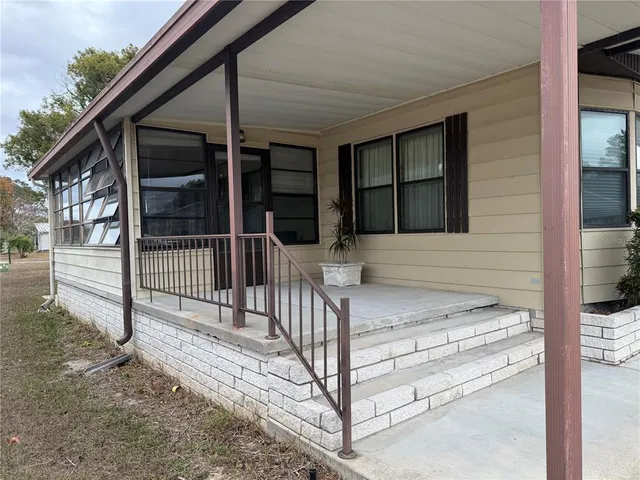 a view of entrance gate of a house
