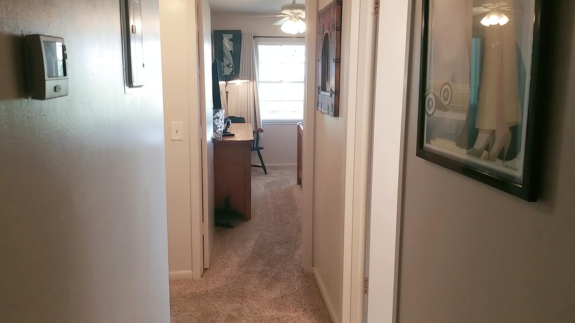 94 Dorset C Boca Raton, FL 33434 - Photo 12 of 20 a view of a bathroom from a hallway