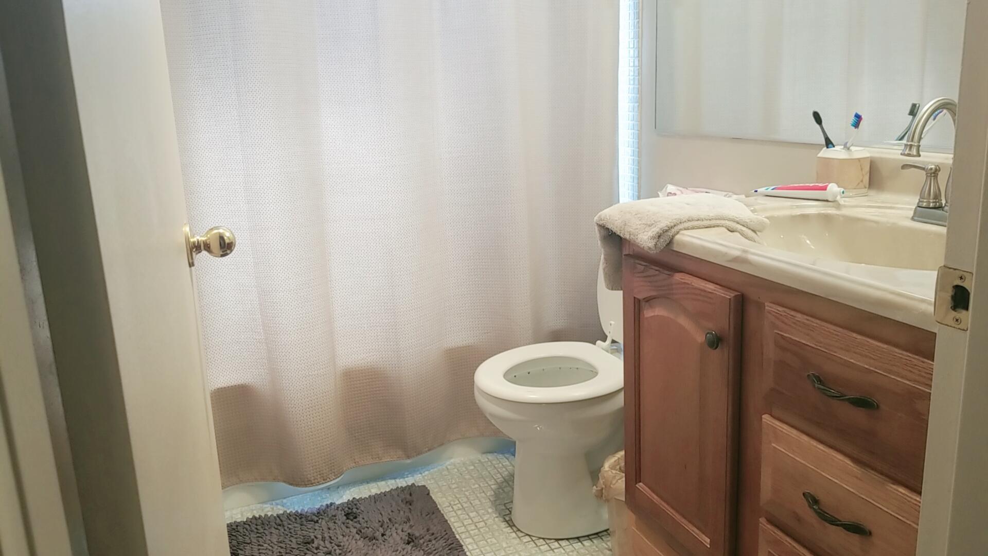 94 Dorset C Boca Raton, FL 33434 - Photo 13 of 20 a bathroom with a sink and toilet