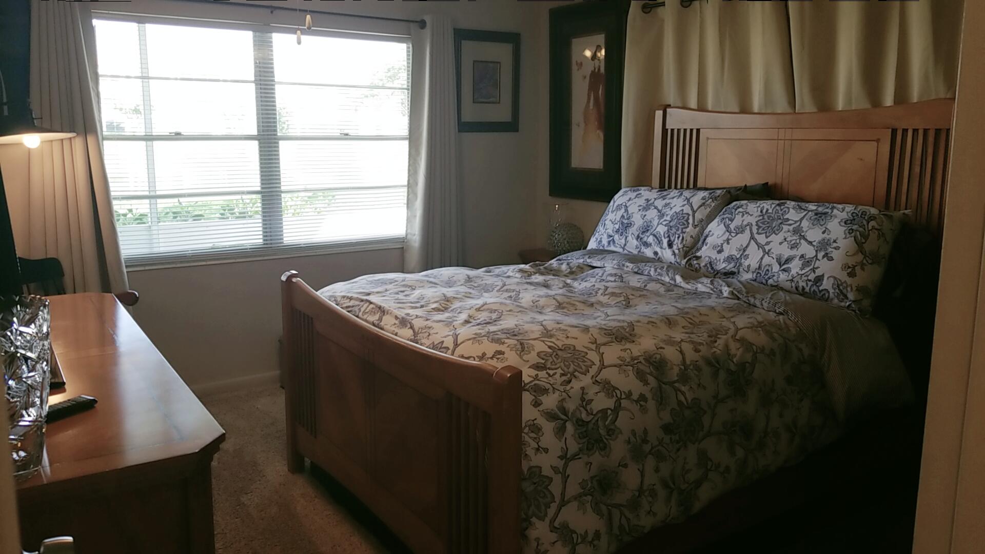 94 Dorset C Boca Raton, FL 33434 - Photo 15 of 20 a bedroom with a bed and a window