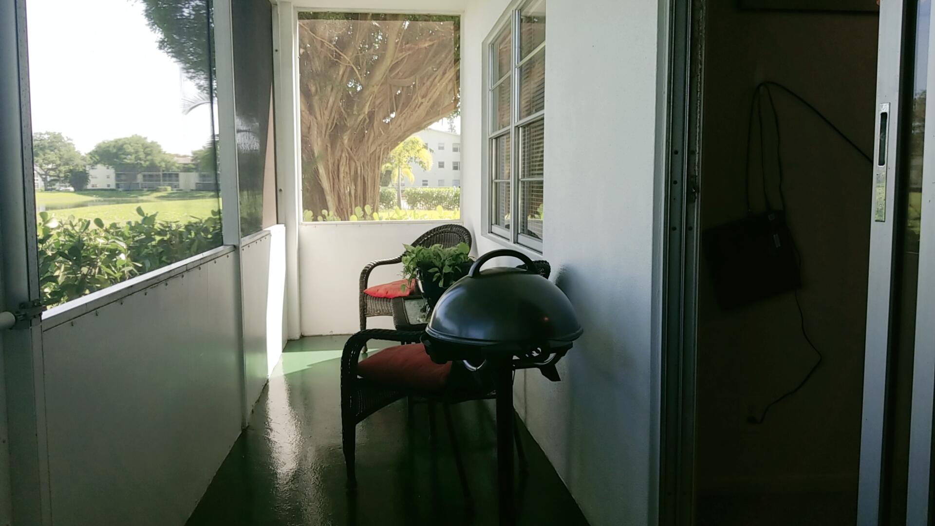 94 Dorset C Boca Raton, FL 33434 - Photo 17 of 20 a view of balcony and chair