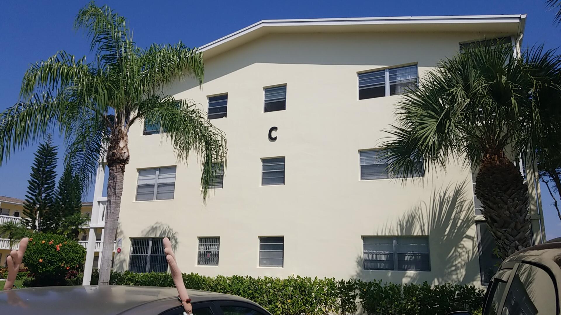 94 Dorset C Boca Raton, FL 33434 - Photo 2 of 20 a view of a house with a yard