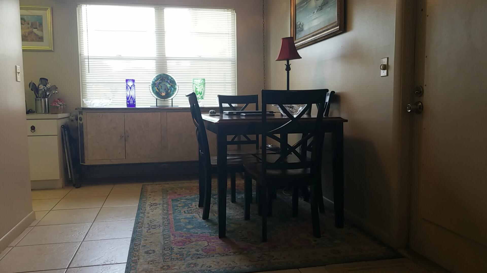 94 Dorset C Boca Raton, FL 33434 - Photo 9 of 20 a view of a dining room with a table and chairs