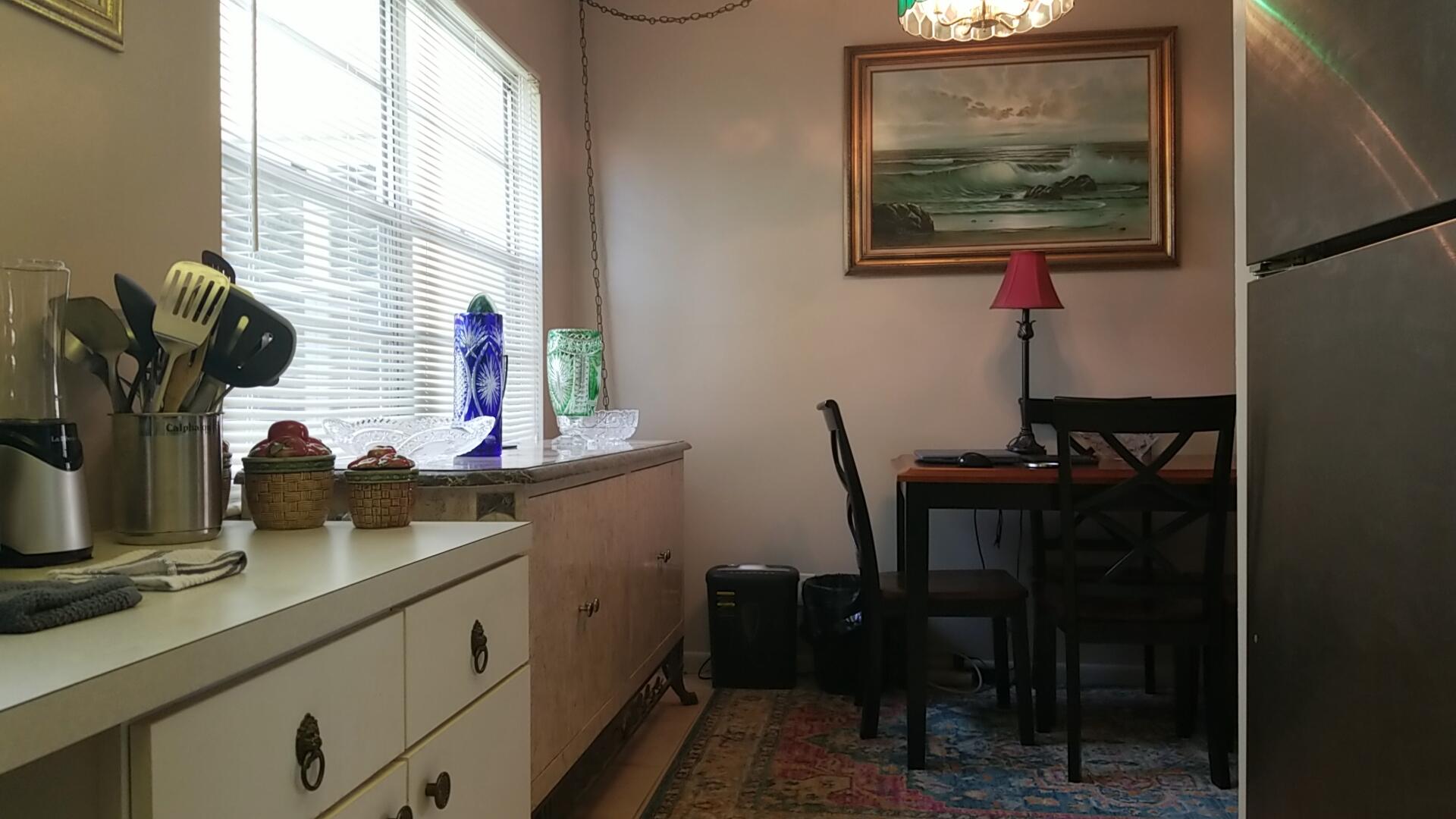 94 Dorset C Boca Raton, FL 33434 - Photo 10 of 20 a bathroom with a sink and a mirror