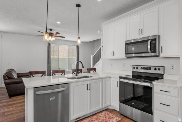 1693 North Center Point Lane Salem, UT 84653 - Photo 5 of 26 Modern kitchen featuring white cabinetry and stainless steel appliances