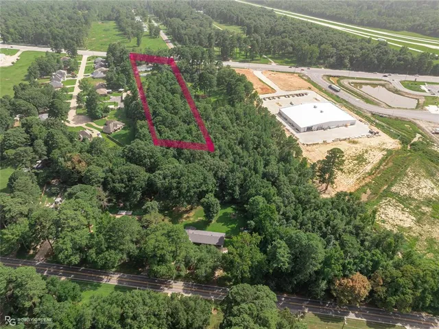 a sign that is sitting on a blue wall