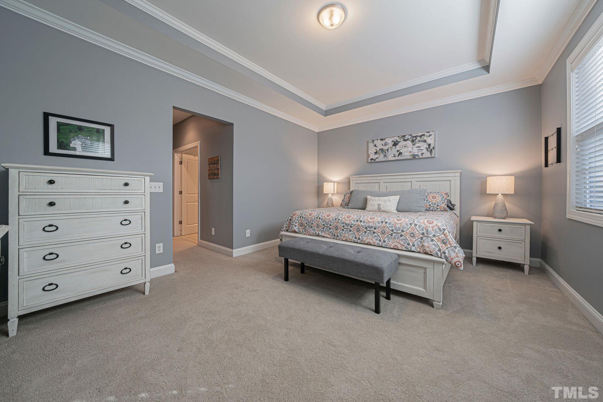 3604 Winifred Way Raleigh, NC 27609 - Photo 11 of 19 a bedroom with a bed and a dresser