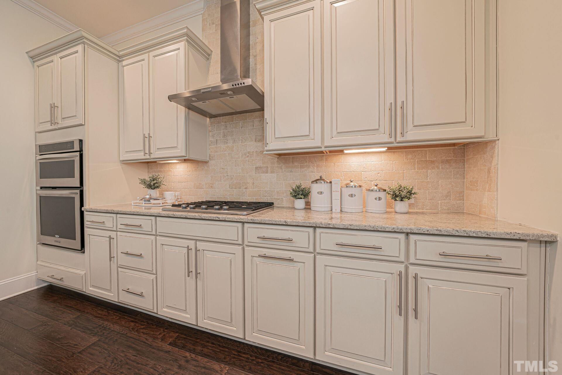 3604 Winifred Way Raleigh, NC 27609 - Photo 7 of 19 a kitchen with stainless steel appliances granite countertop white cabinets and a sink