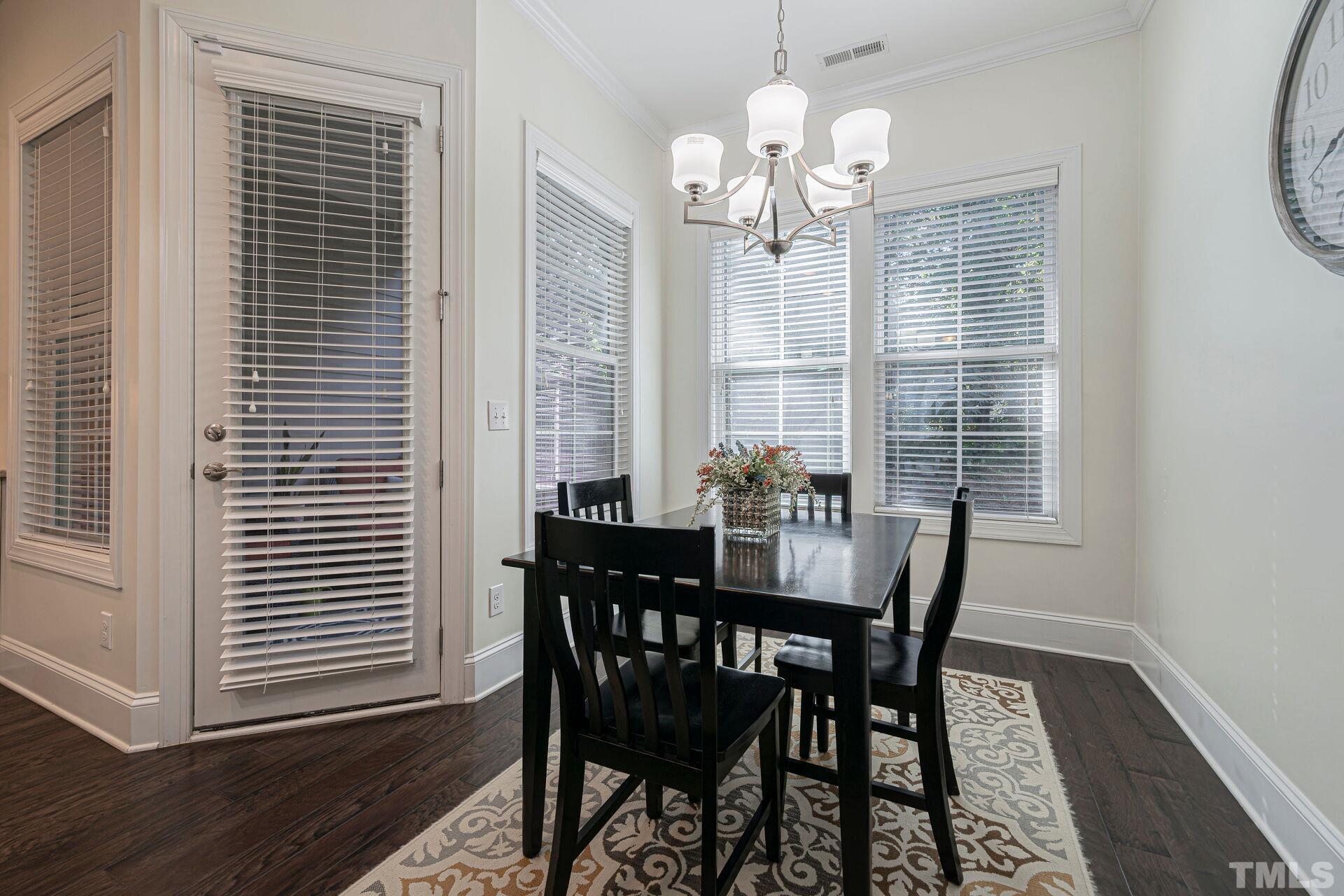 3604 Winifred Way Raleigh, NC 27609 - Photo 9 of 19 a view of a dining room with furniture and window