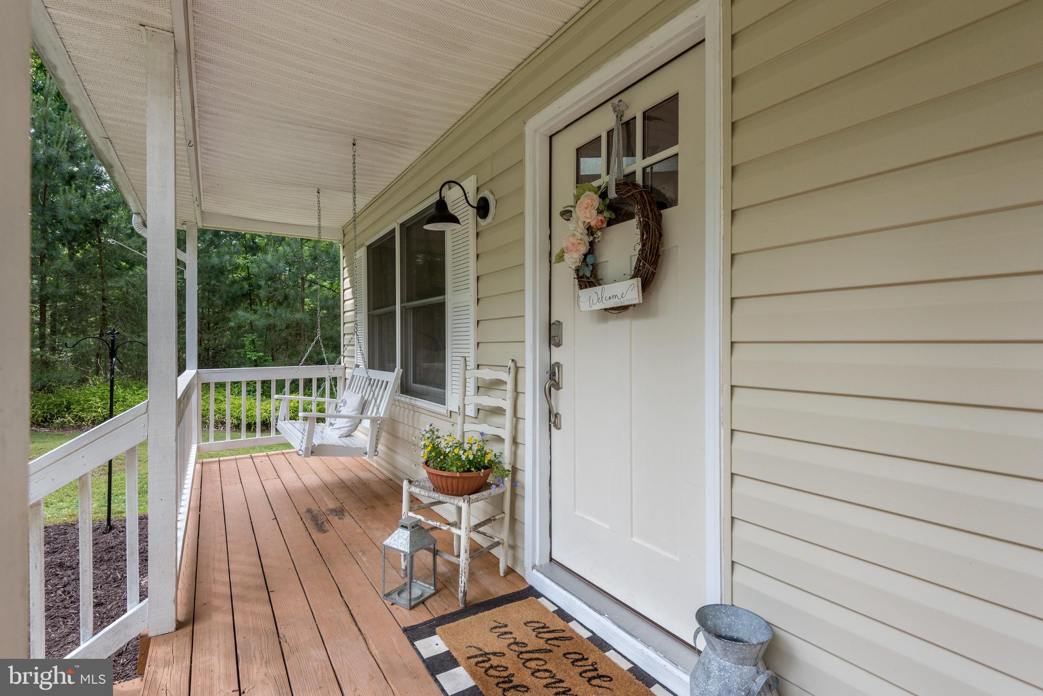 12430 Ridge Road Lusby, MD 20657 - Photo 2 of 36 a view of balcony with furniture