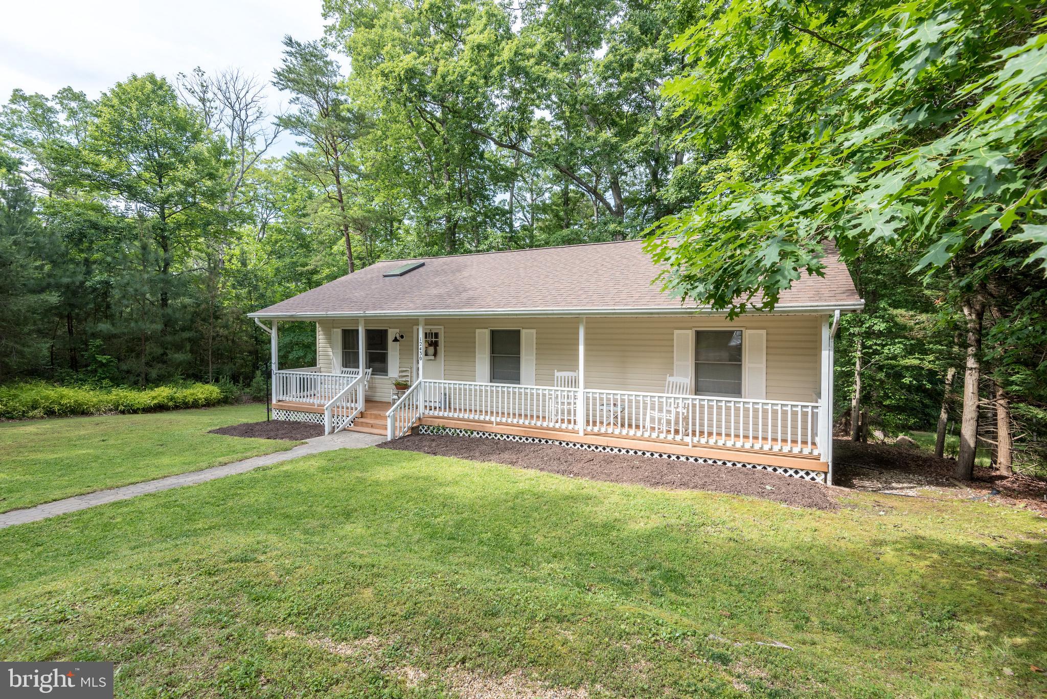12430 Ridge Road Lusby, MD 20657 - Photo 11 of 36 front view of a house with a yard