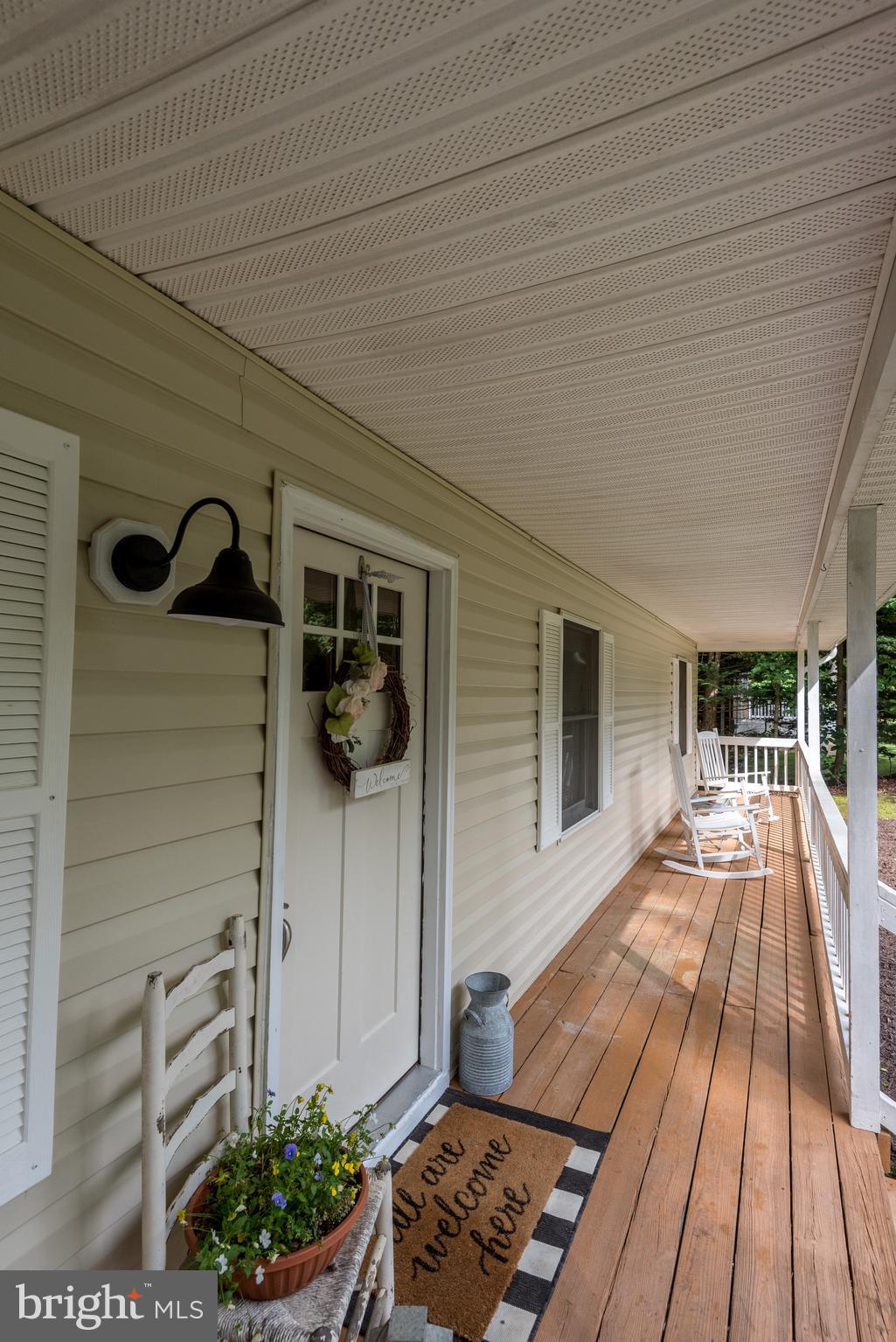 12430 Ridge Road Lusby, MD 20657 - Photo 13 of 36 a view of balcony with wooden floor and seating space