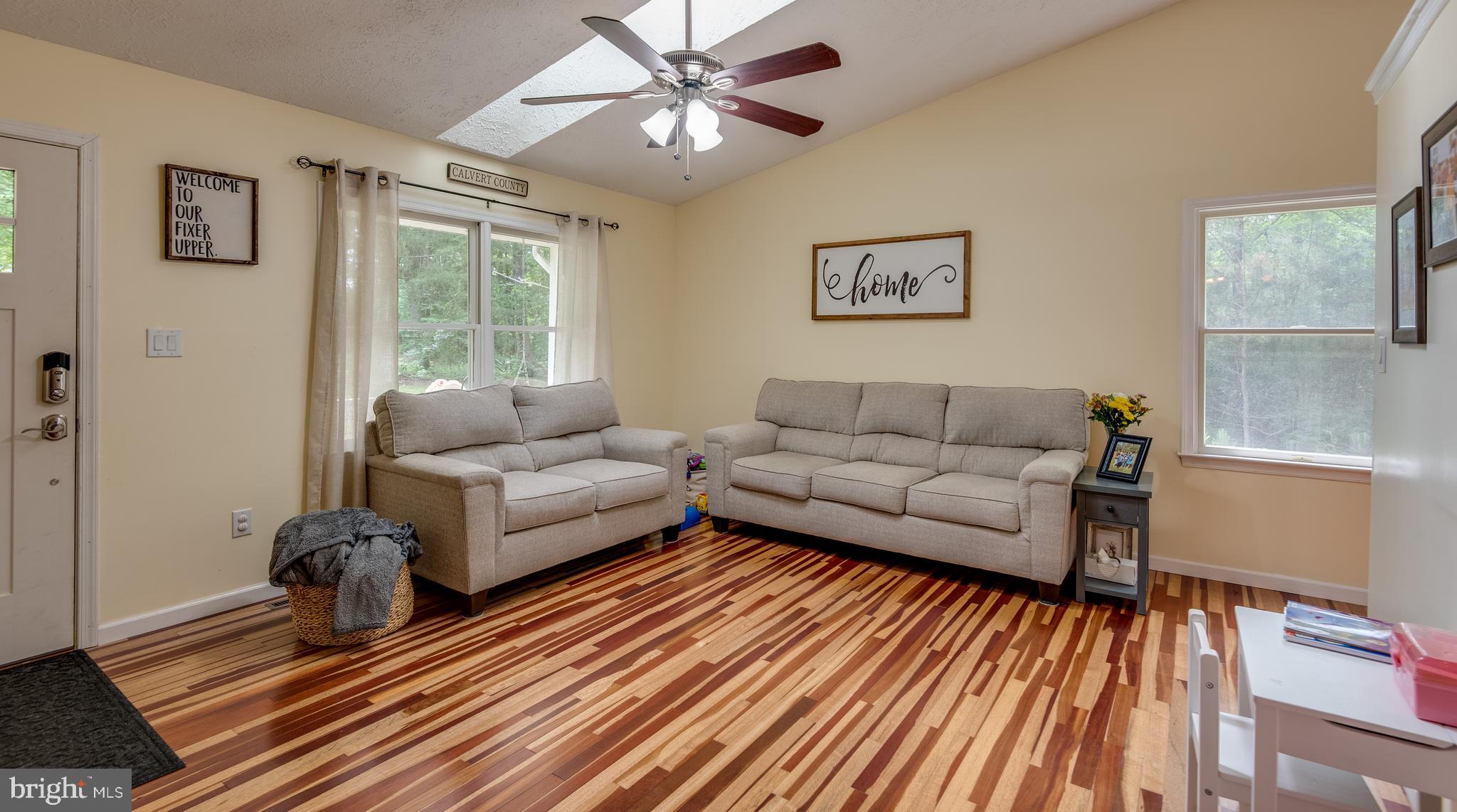 12430 Ridge Road Lusby, MD 20657 - Photo 16 of 36 a living room with furniture and a large window