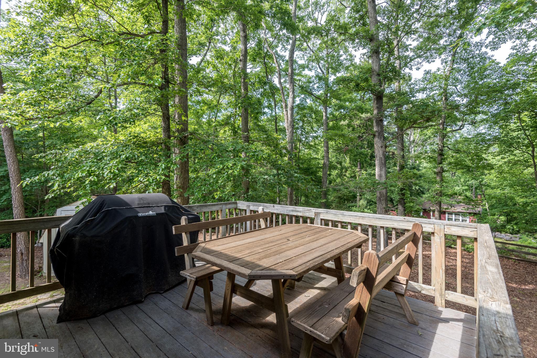 12430 Ridge Road Lusby, MD 20657 - Photo 20 of 36 a view of balcony with wooden floor and outdoor seating