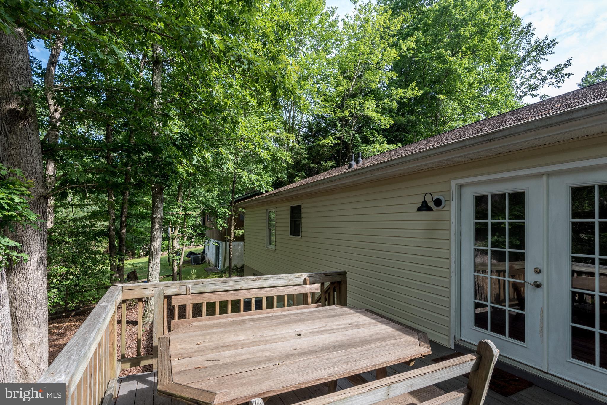 12430 Ridge Road Lusby, MD 20657 - Photo 21 of 36 a front view of a house with trees