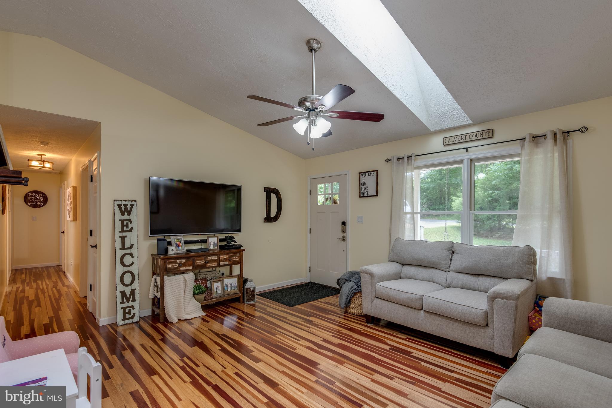 12430 Ridge Road Lusby, MD 20657 - Photo 5 of 36 a living room with furniture and a flat screen tv