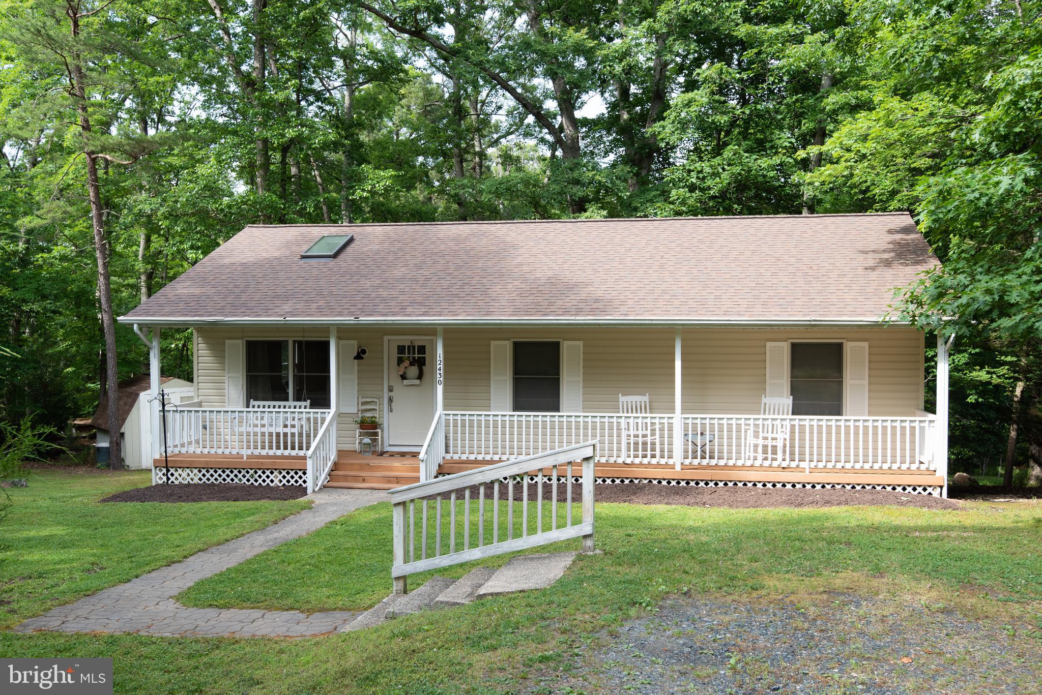 12430 Ridge Road Lusby, MD 20657 - Photo 10 of 36 a view of a house with a yard and a large tree