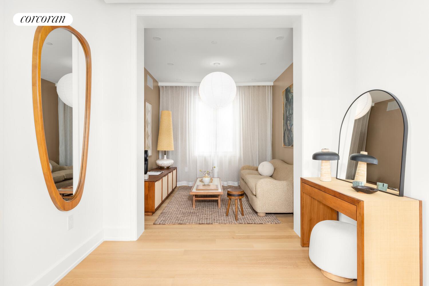 420 East 75th Street, Unit 4 Manhattan, NY 10021 - Photo 12 of 22 a living room with furniture and a mirror