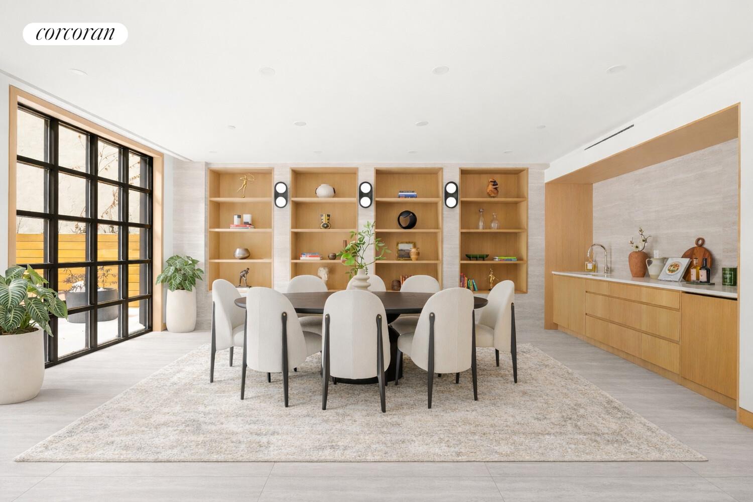 420 East 75th Street, Unit 4 Manhattan, NY 10021 - Photo 15 of 22 a living room with couches a coffee table and a large window with outer view