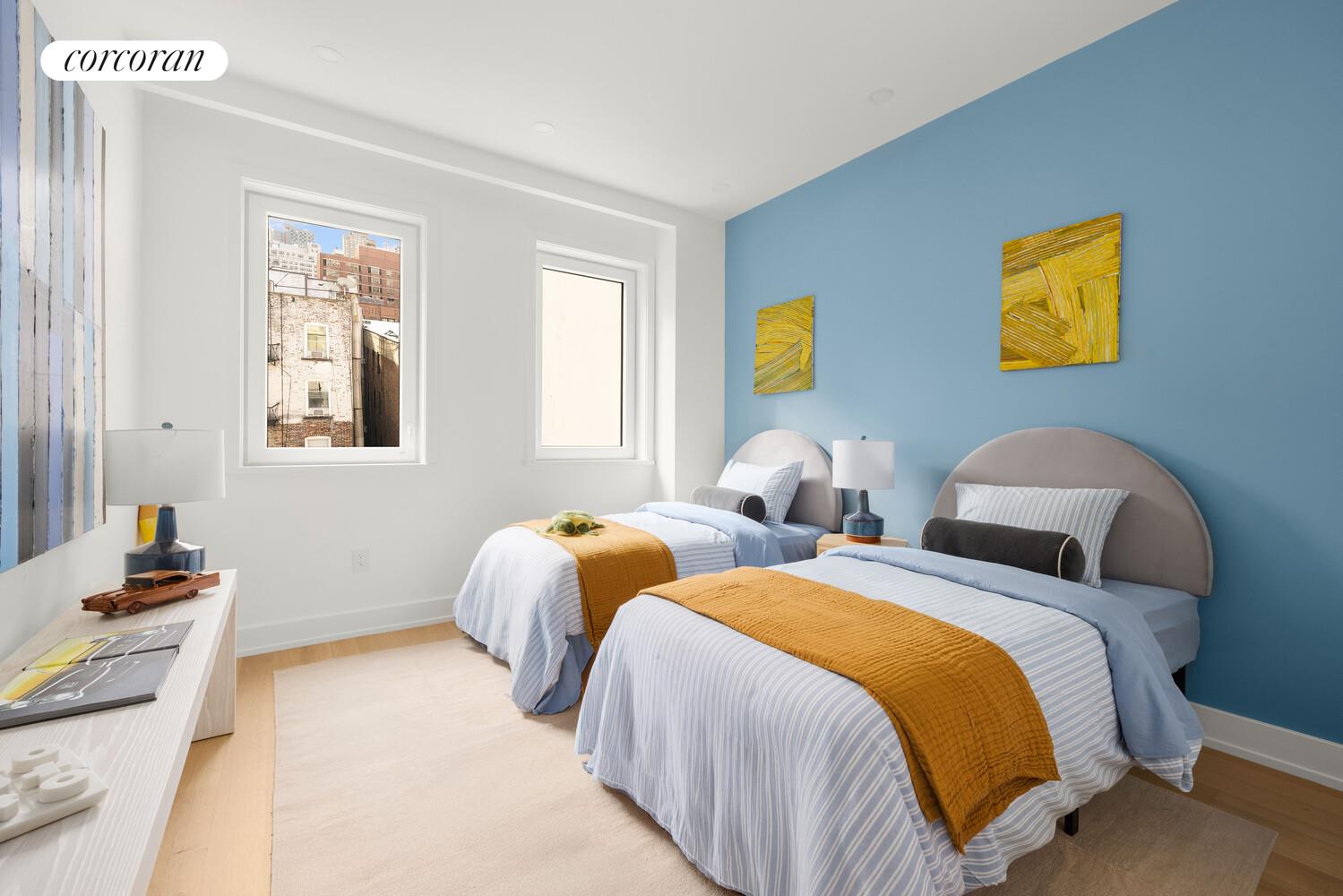 420 East 75th Street, Unit 4 Manhattan, NY 10021 - Photo 8 of 22 a bedroom with two beds and painting on the wall