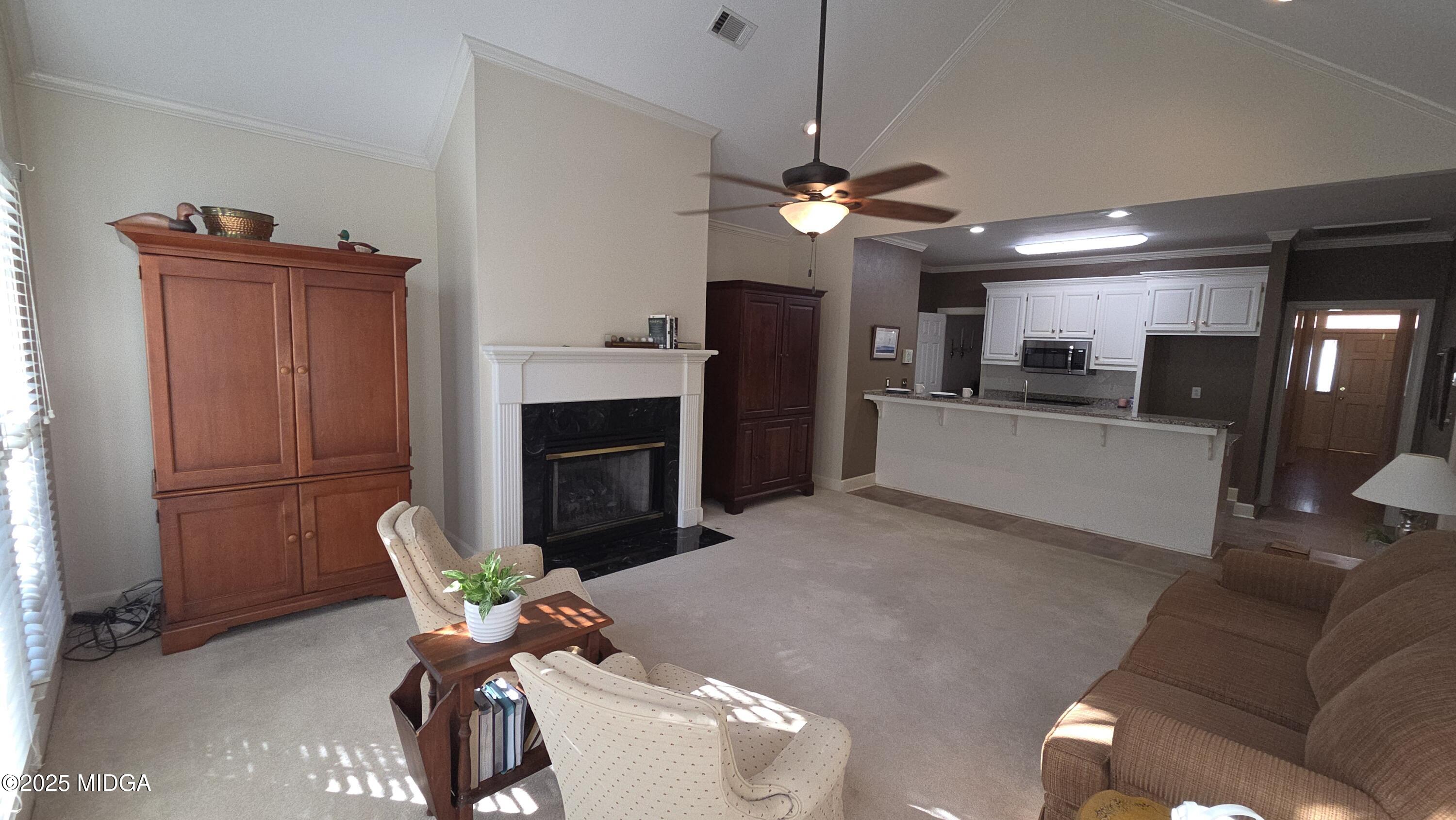 107 North Wellington Macon, GA 31210 - Photo 13 of 23 a living room with furniture a fireplace and a television