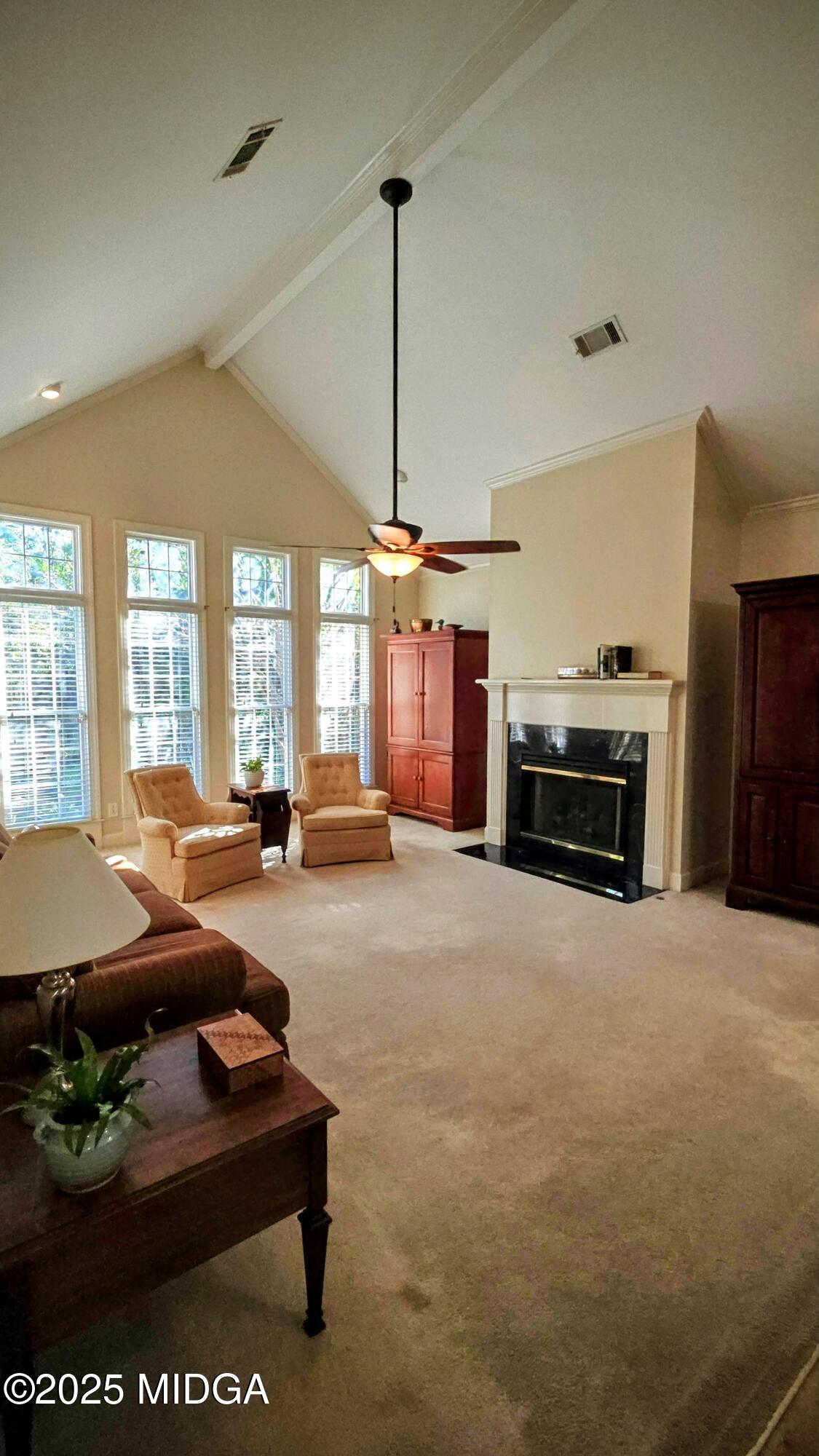 107 North Wellington Macon, GA 31210 - Photo 15 of 23 a living room with furniture a large window and kitchen view