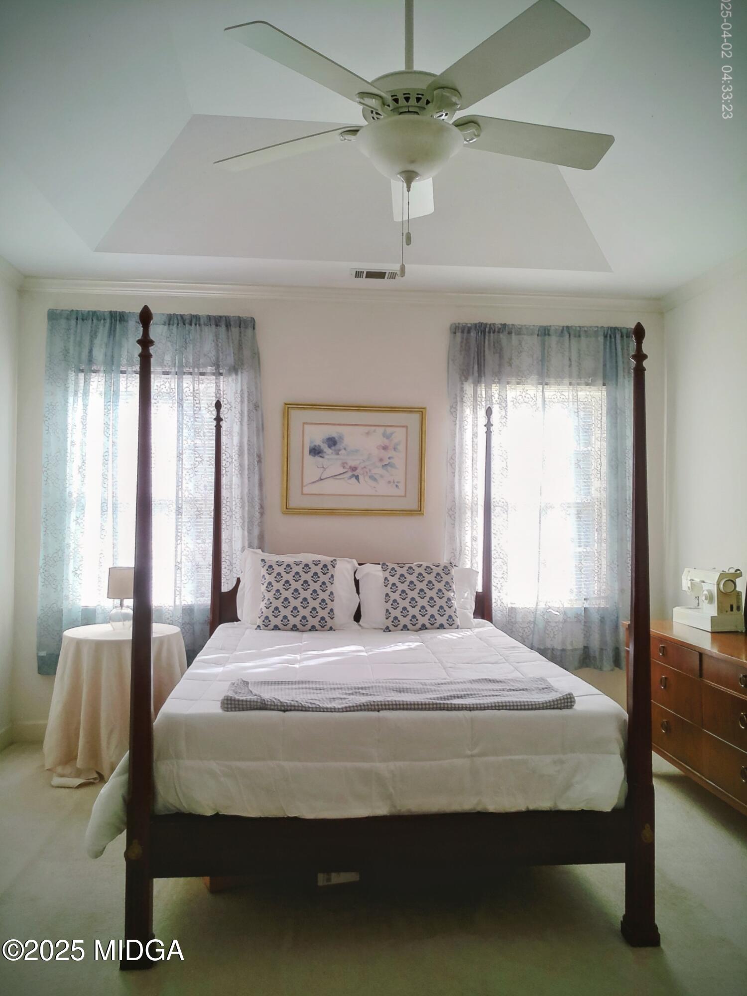 107 North Wellington Macon, GA 31210 - Photo 19 of 23 a bedroom with a large bed and a chandelier