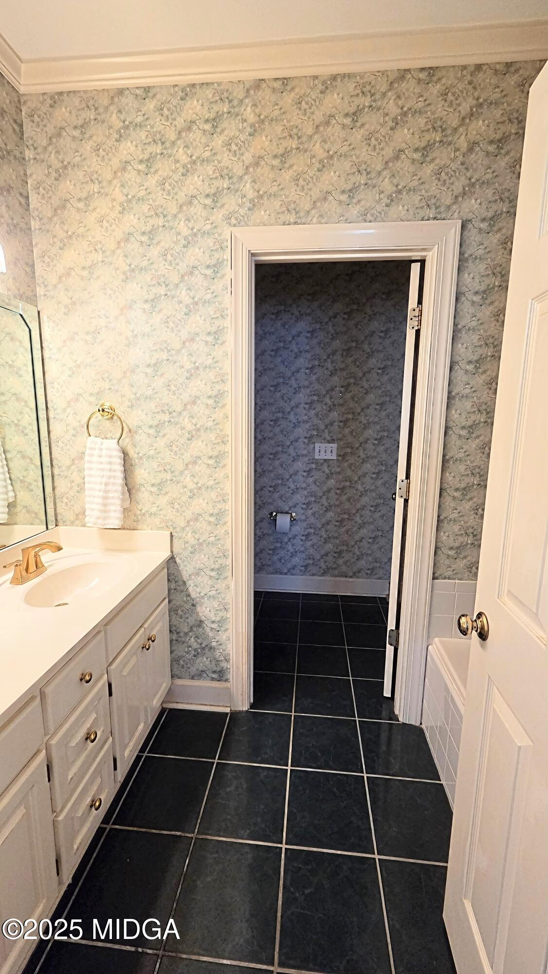 107 North Wellington Macon, GA 31210 - Photo 20 of 23 a bathroom with a sink a toilet and a shower