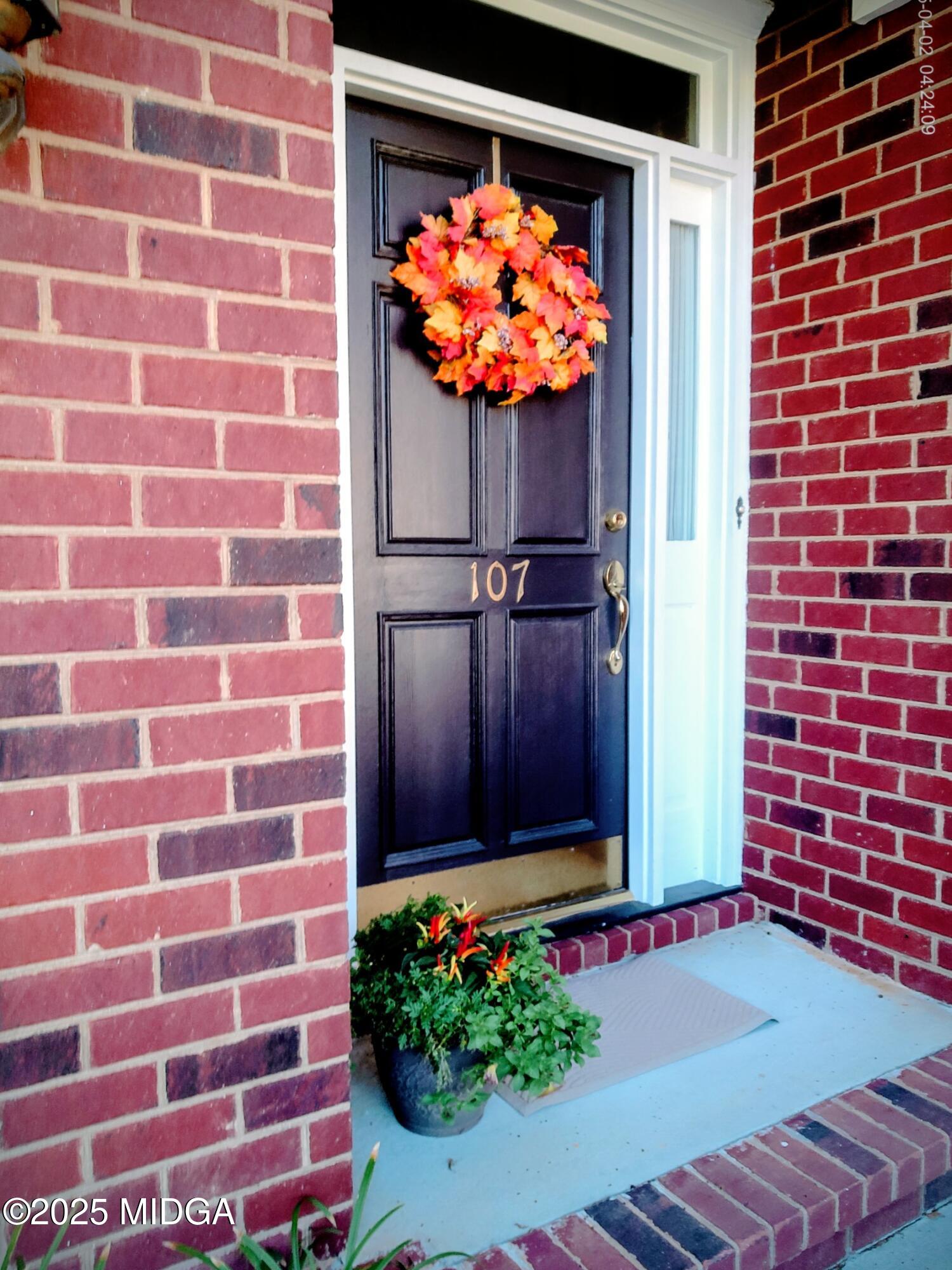 107 North Wellington Macon, GA 31210 - Photo 3 of 23 a view of a brick house with a yard