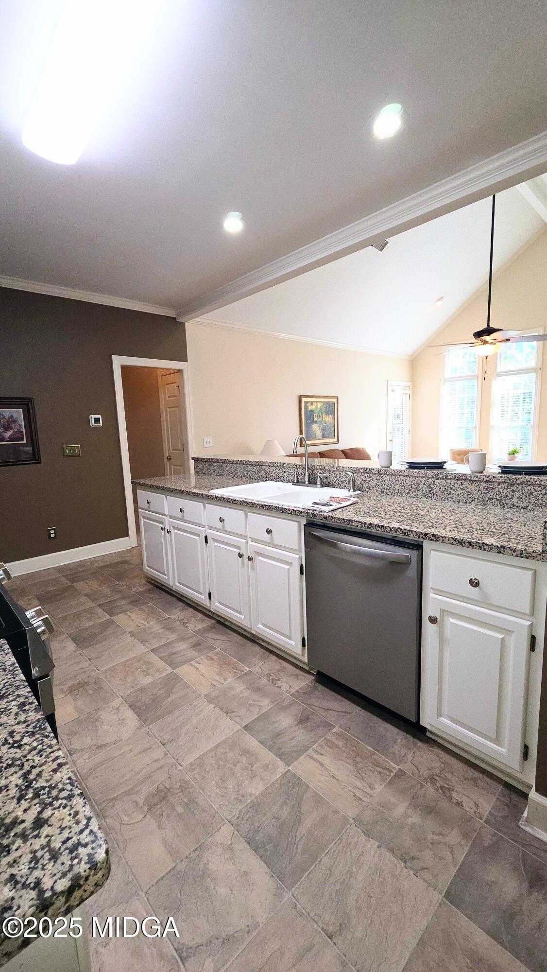 107 North Wellington Macon, GA 31210 - Photo 9 of 23 a kitchen with stainless steel appliances granite countertop a stove a sink and a microwave