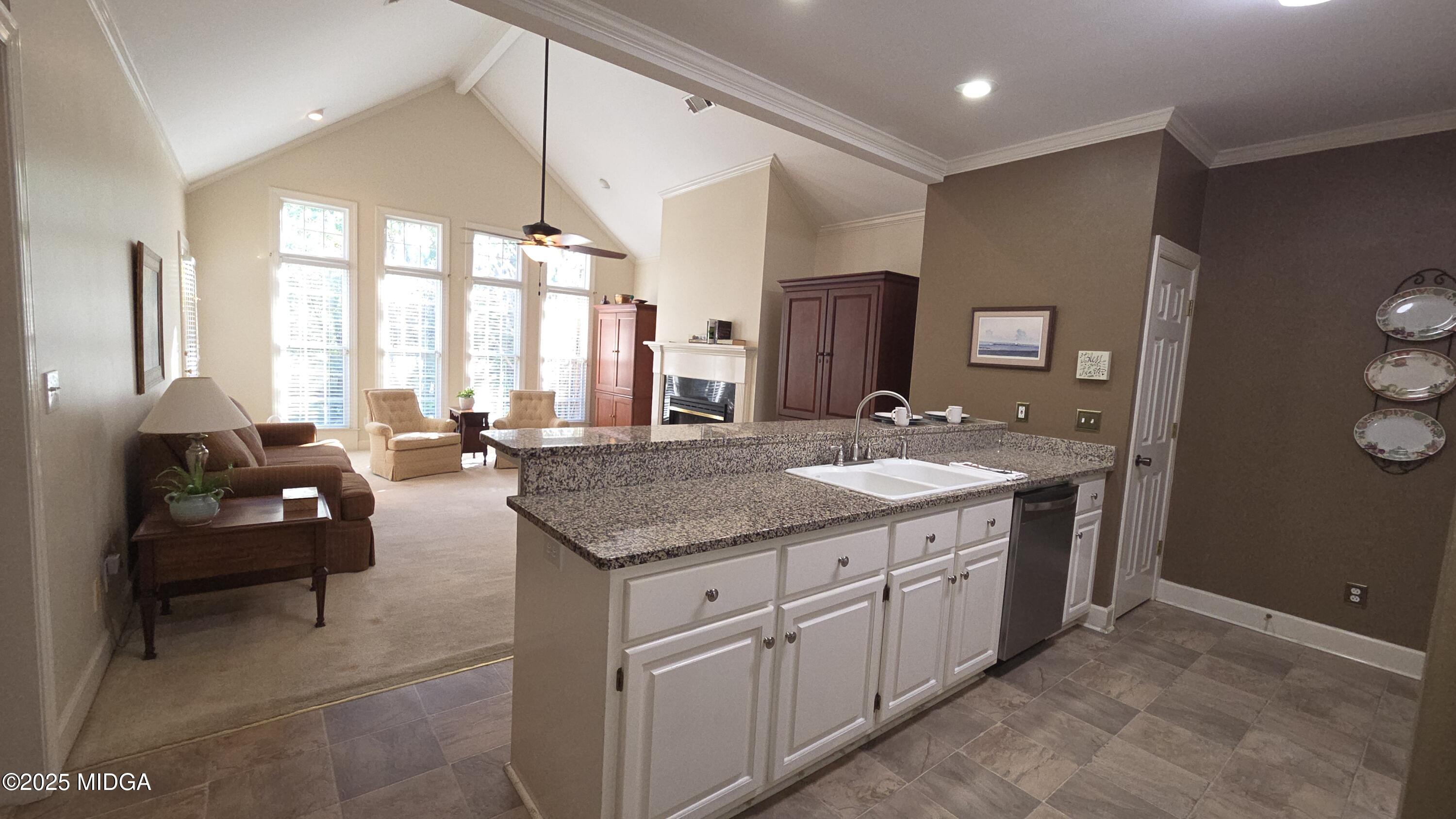 107 North Wellington Macon, GA 31210 - Photo 10 of 23 a bathroom with a granite countertop sink and a large mirror
