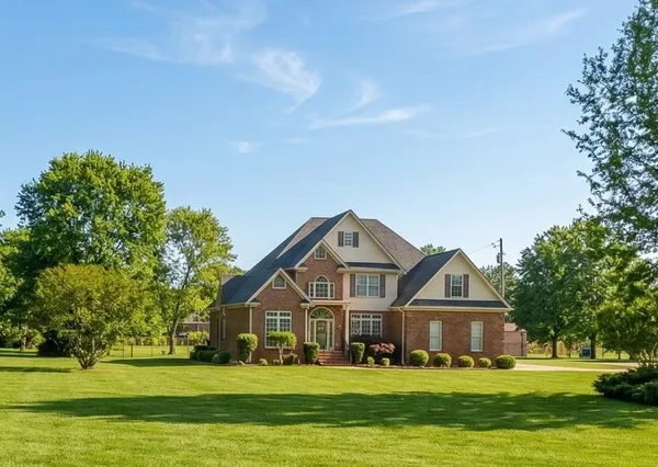 a front view of a house with a yard