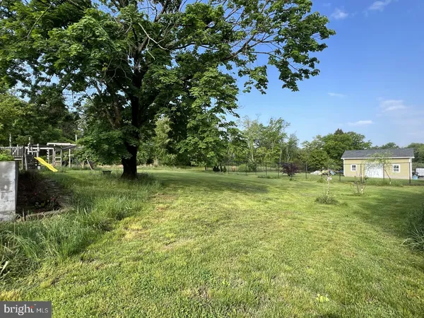 a view of a lake with a yard