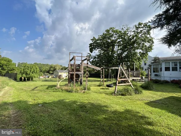 a view of a park with swings and a slide