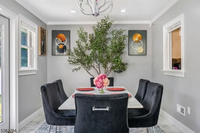 a dining room with furniture and window