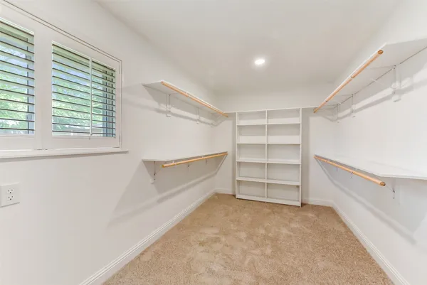 a view of an empty walk in closet