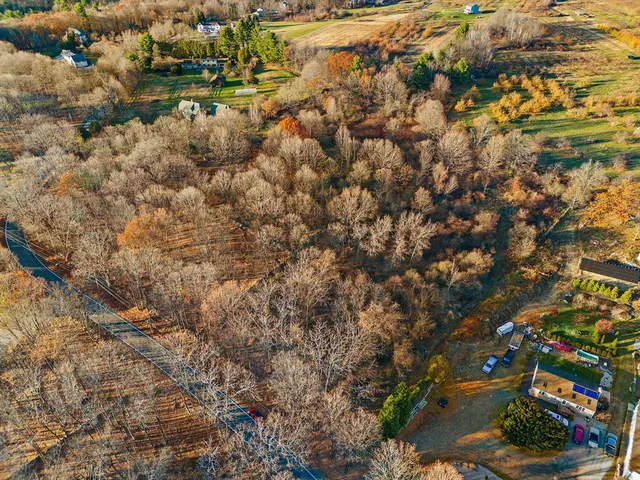 an aerial view of residential building with parking space