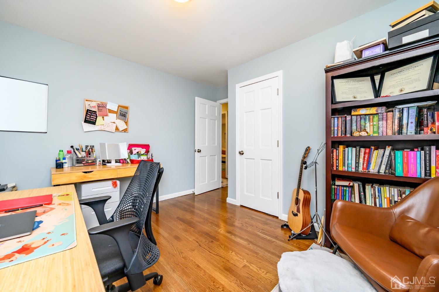 10 Ferris Road Edison, NJ 08817 - Photo 21 of 32 a view of a workspace with furniture and a book shelf