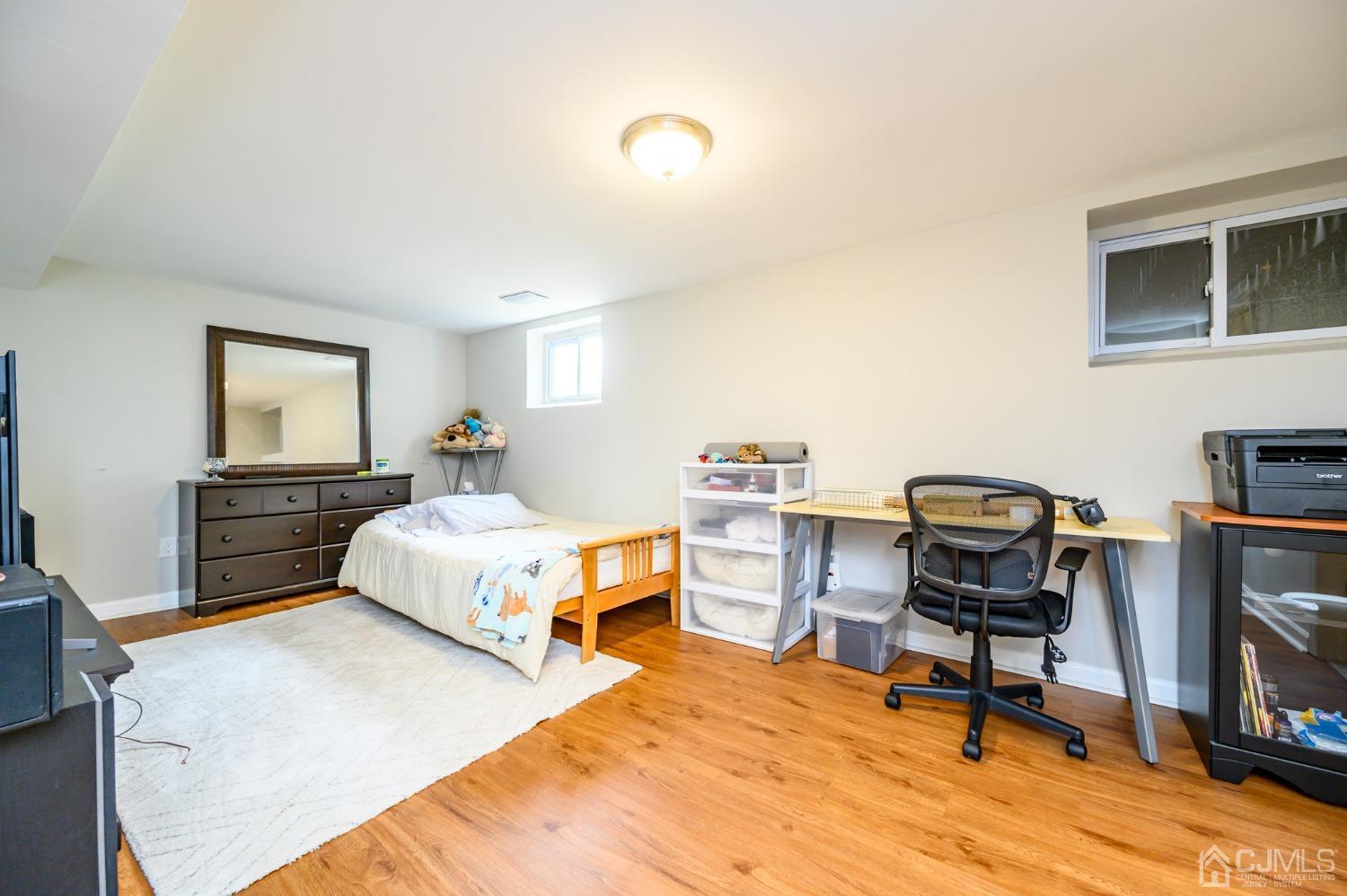 10 Ferris Road Edison, NJ 08817 - Photo 22 of 32 a bedroom with a bed and a desk